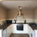 The kitchen is fully fitted. It has an oven, hob, microwave, toaster, fridge (with freezer compartment) and washing machine.