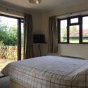 The main bedroom has a king size bed, two bed side tables and a double wardrobe. It also has FreeSAT TV.